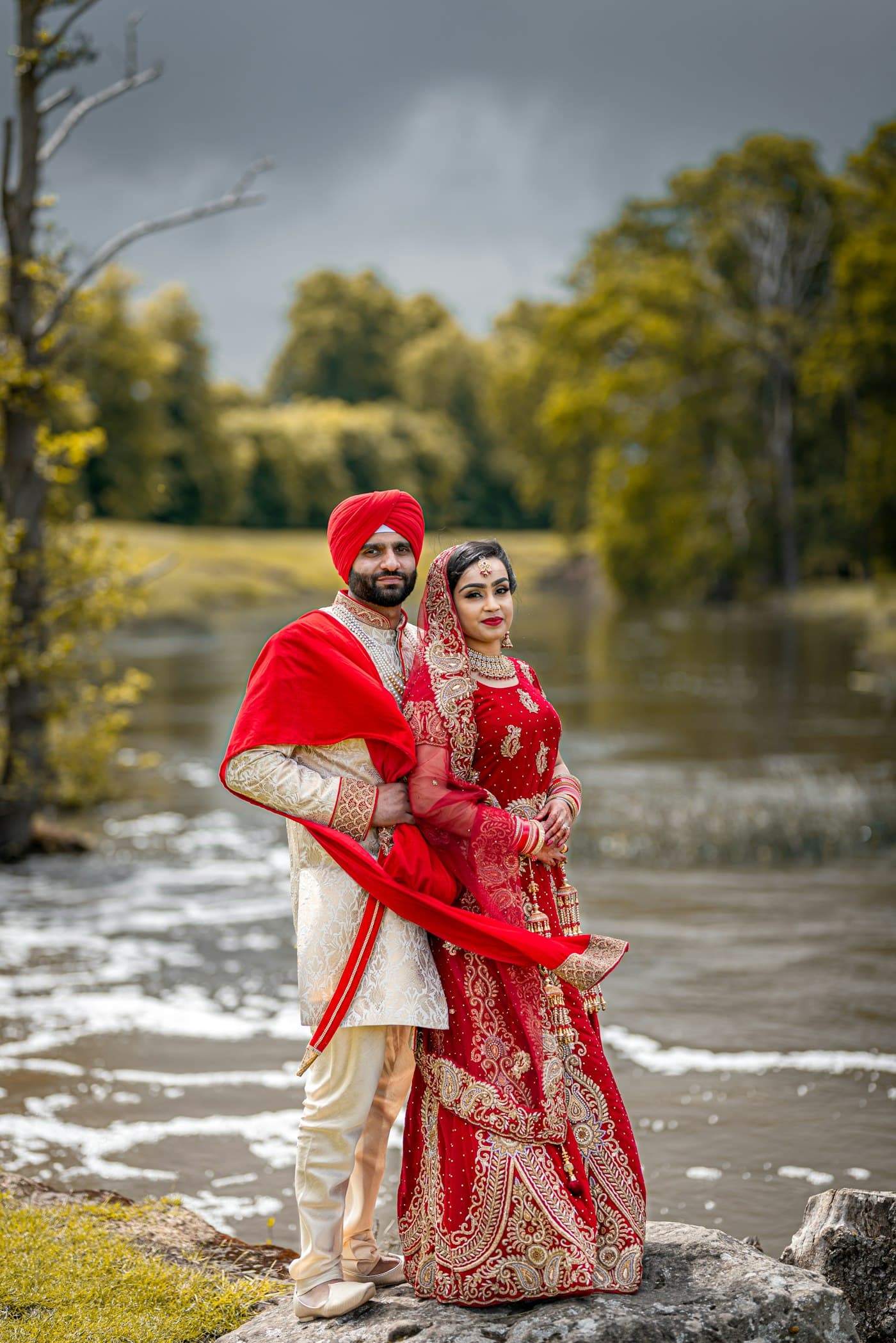 Traditional Indian wedding couple portrait in red attire
