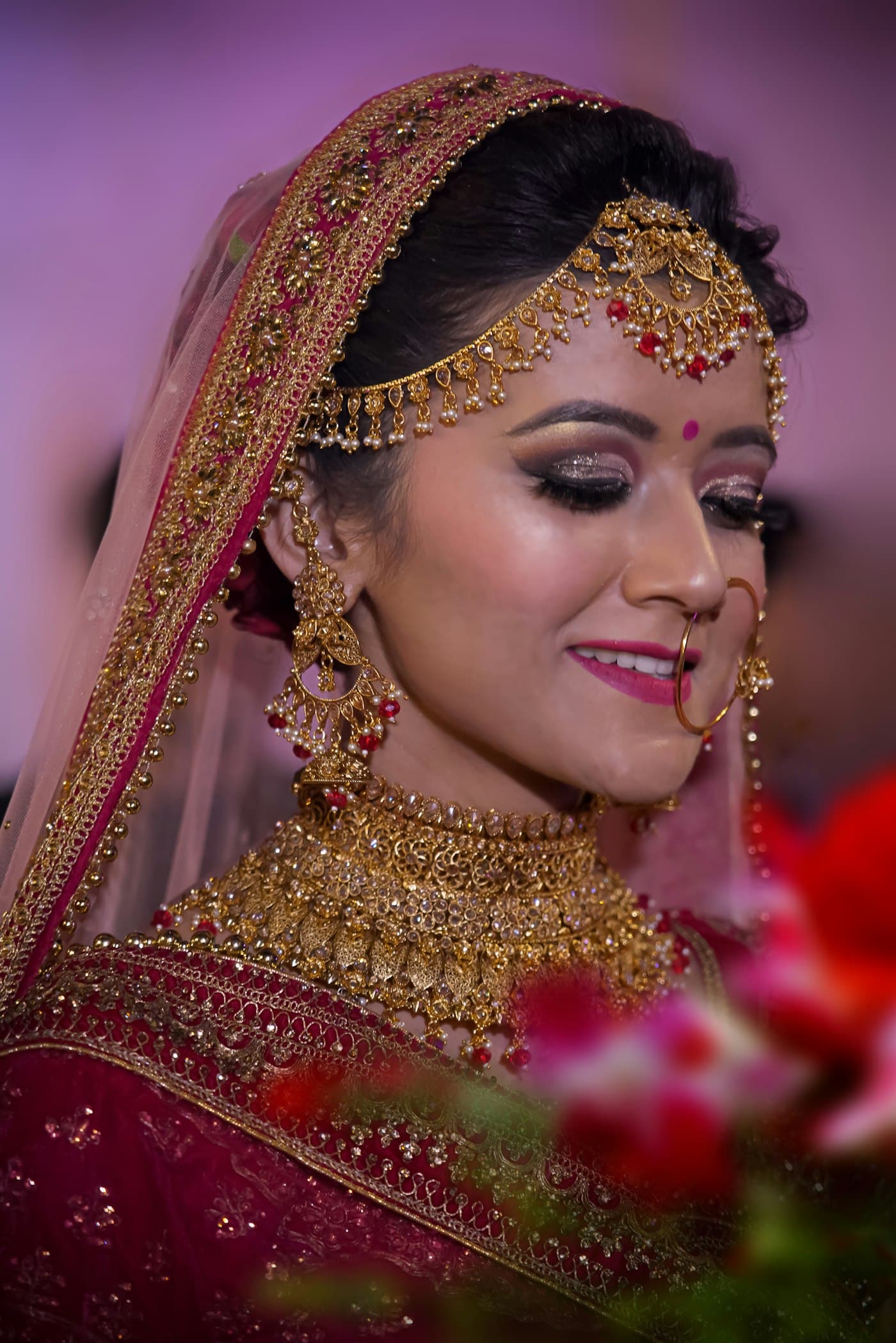Close bridal portrait with jewelry and veil details